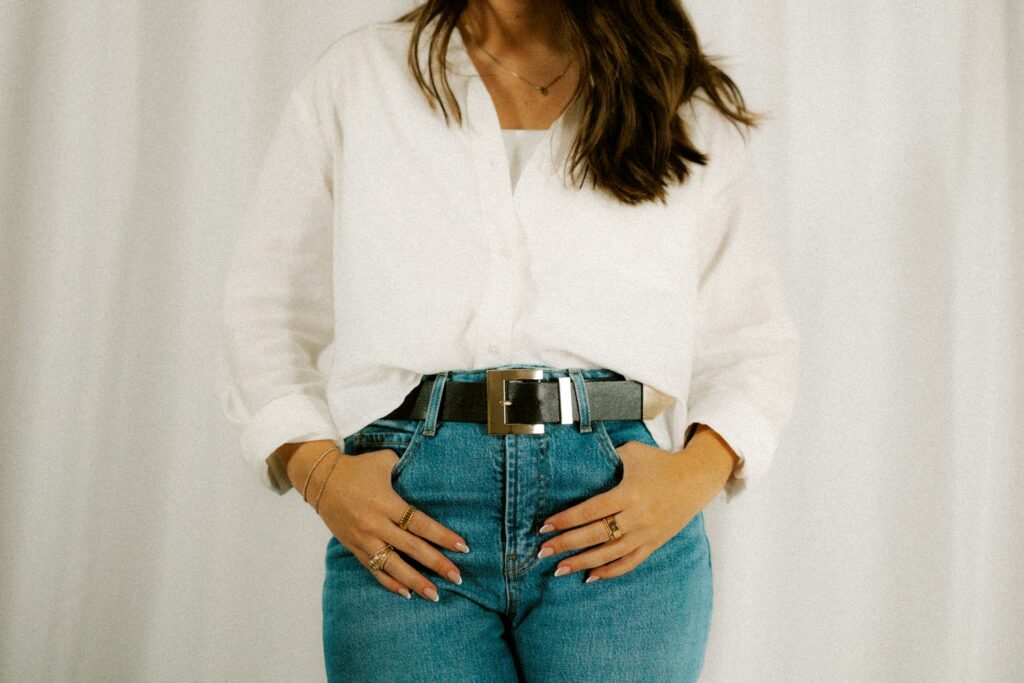 "Curvy woman styling high-waisted jeans for summer."