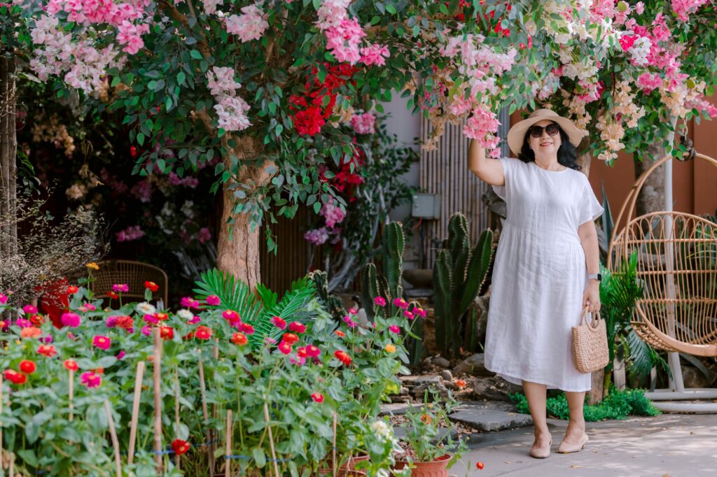 Curvy woman wearing a lightweight summer dress made from breathable fabric.