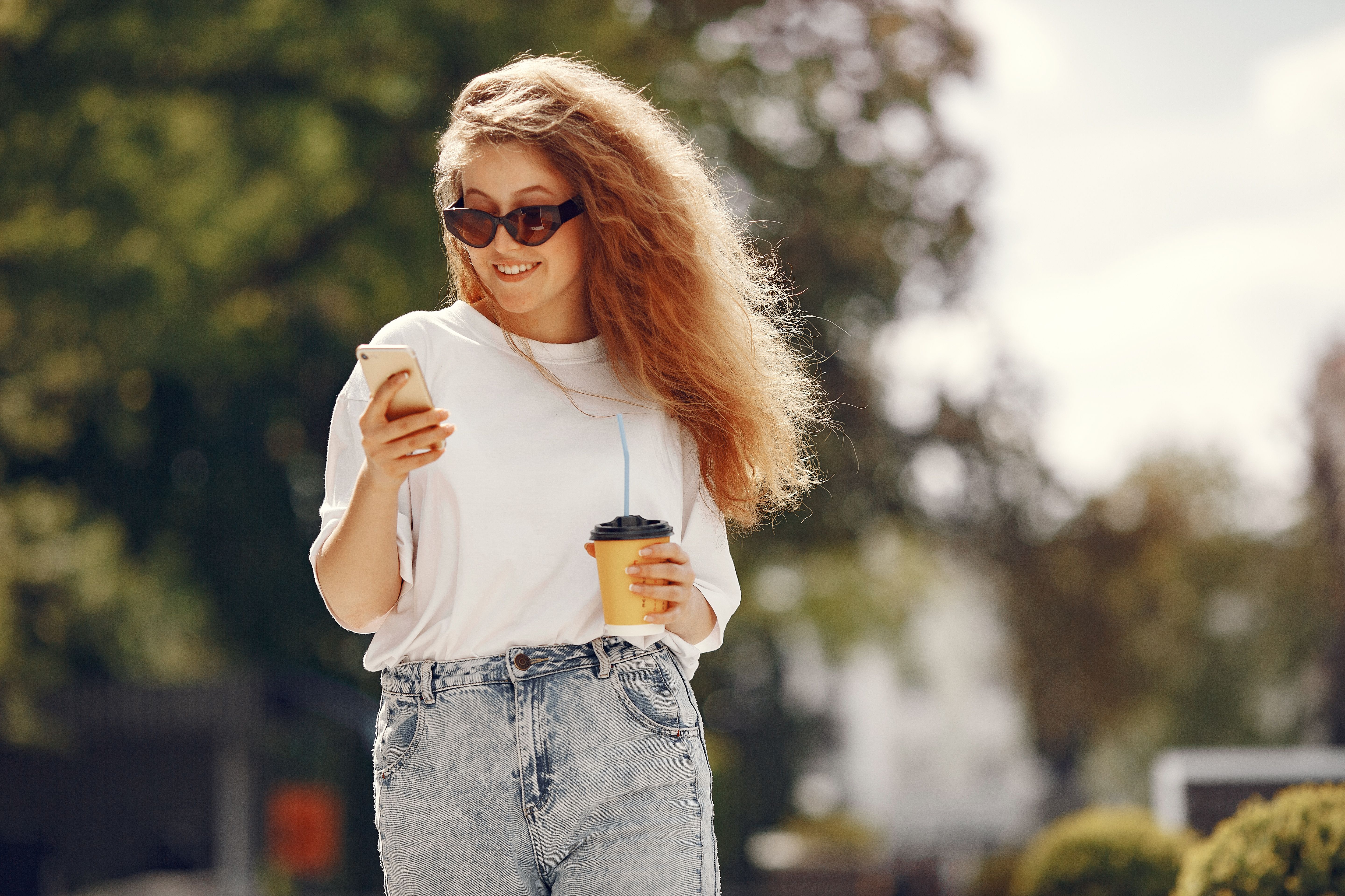 Classic white T-shirt styled with blue jeans for a timeless casual outfit.