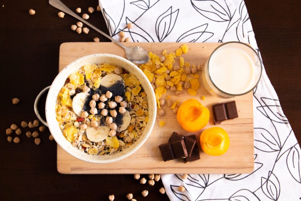 Healthy foods and drinks that may help you sleep better naturally, including almonds, bananas, kiwi, chamomile tea, warm milk, and tart cherries.